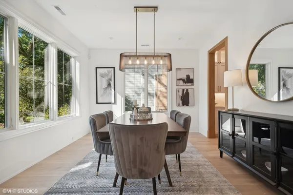 a view of a dining room with furniture window and outside view