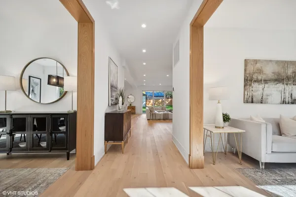a view of a living room and a wooden floor