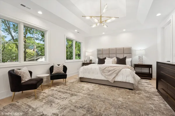 a bed room with a bed window and couch