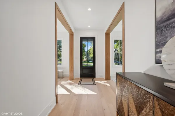 a view of hallway with wooden floor