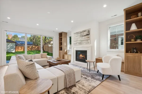 a spacious bedroom with a bed and glass window