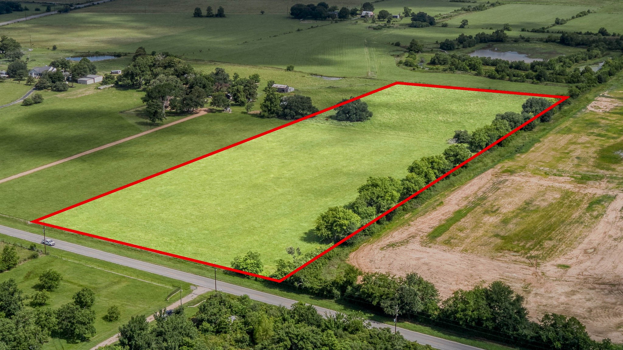 32626 Knebel Road Waller, TX 77484 - Photo 20 of 21 an aerial view of a golf course with a swimming pool