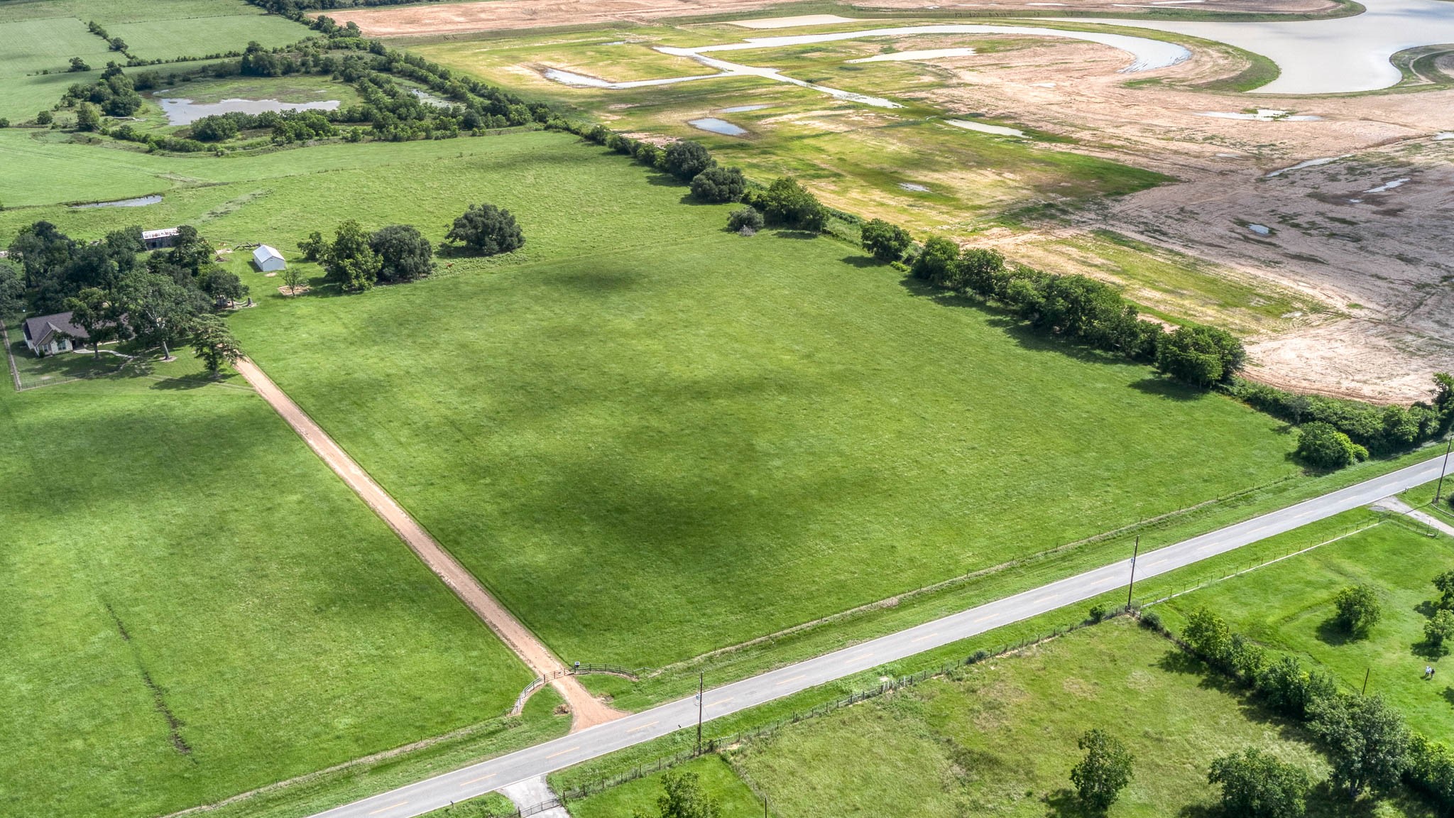 32626 Knebel Road Waller, TX 77484 - Photo 5 of 21 a view of a lake from a yard