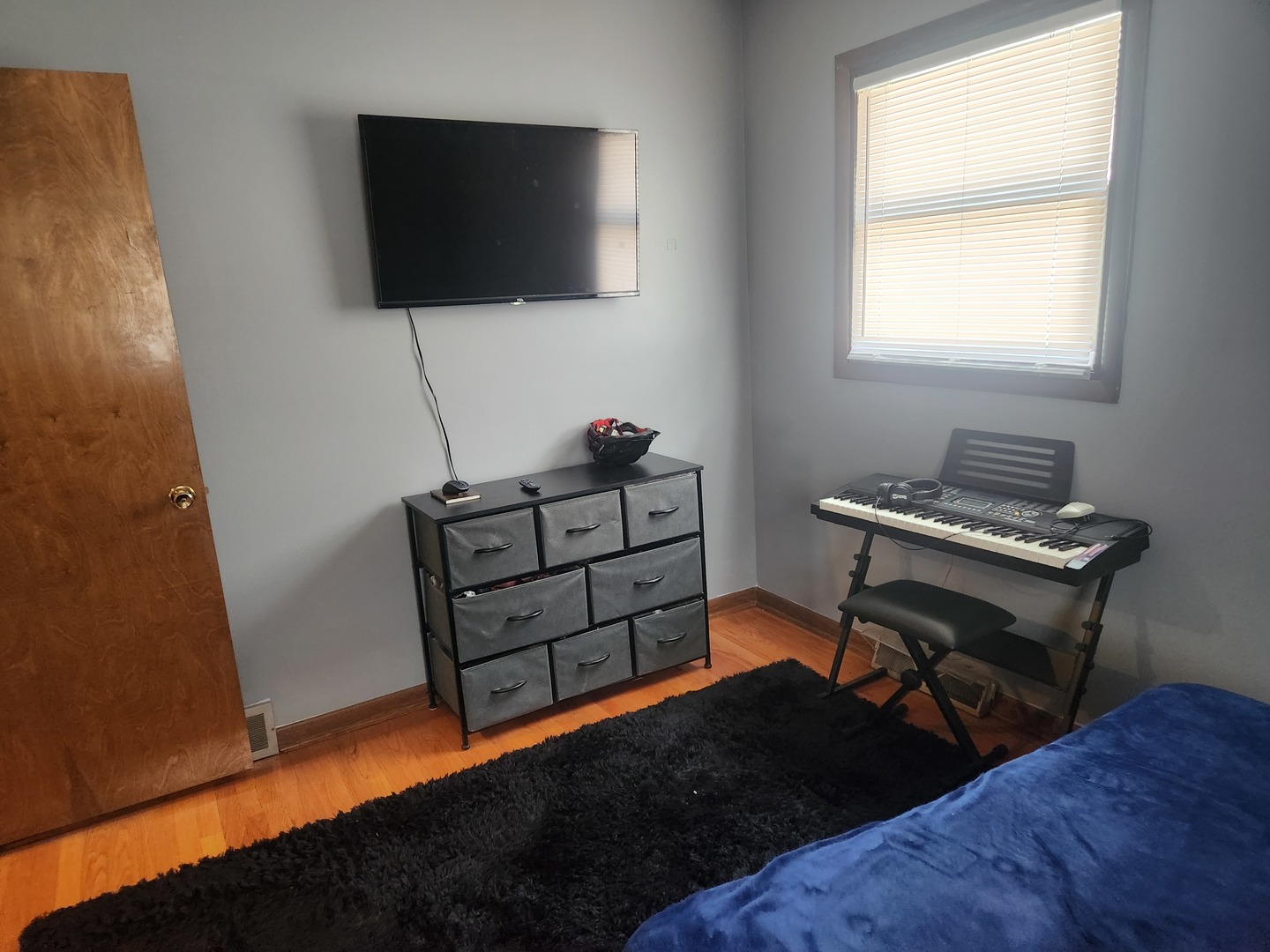 Undisclosed Address Lansing, IL 60438 - Photo 15 of 16 a bedroom with a bed and a furniture