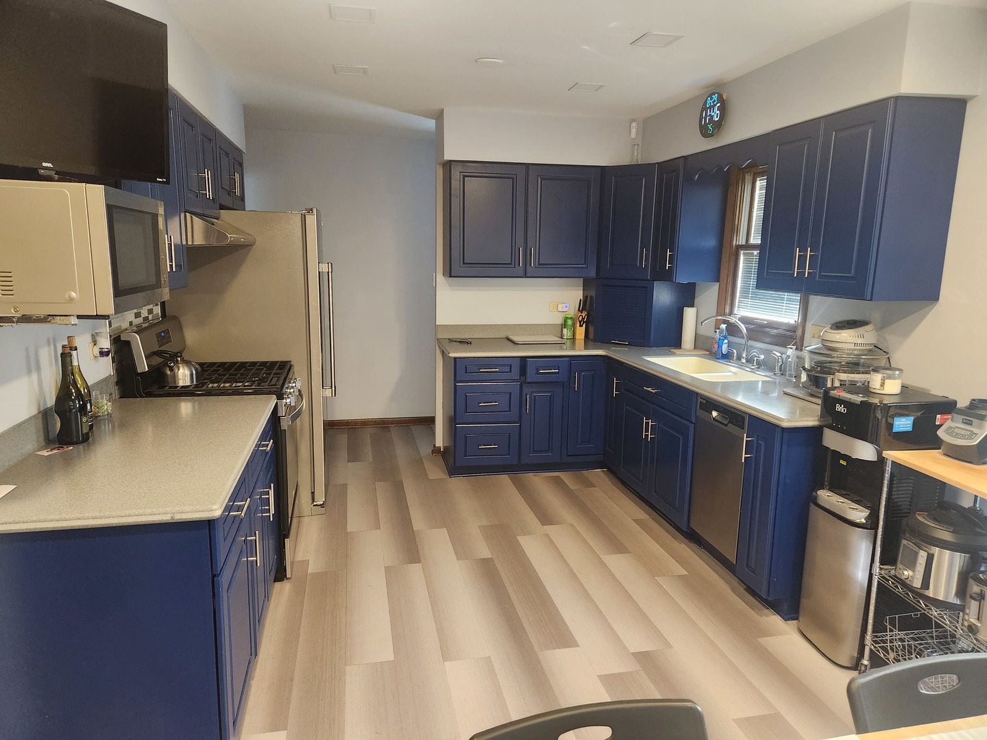 Undisclosed Address Lansing, IL 60438 - Photo 2 of 16 a kitchen with wooden cabinets and sink