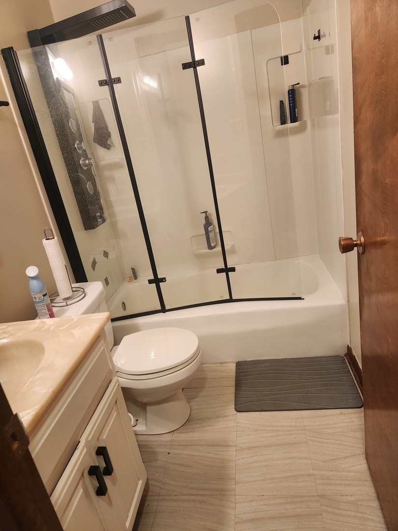 Undisclosed Address Lansing, IL 60438 - Photo 6 of 16 a bathroom with a toilet and a shower