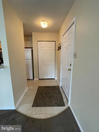 an empty room with a empty space and a window