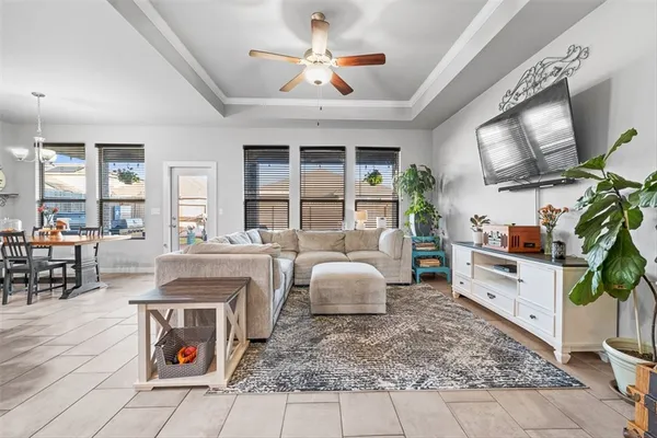 a living room with fireplace furniture and a flat screen tv