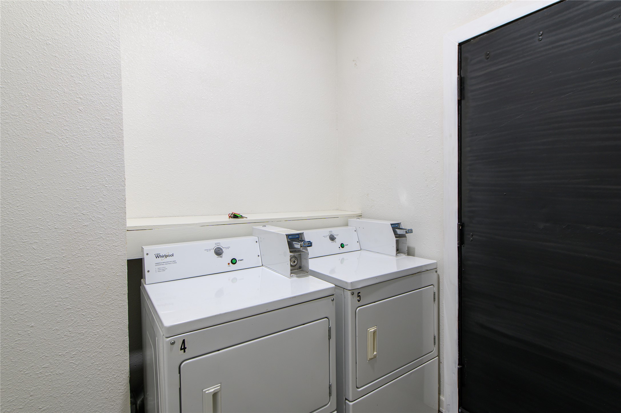 4705 Lyons Avenue, Unit 1 Houston, TX 77020 - Photo 11 of 19 a utility room with dryer and washer