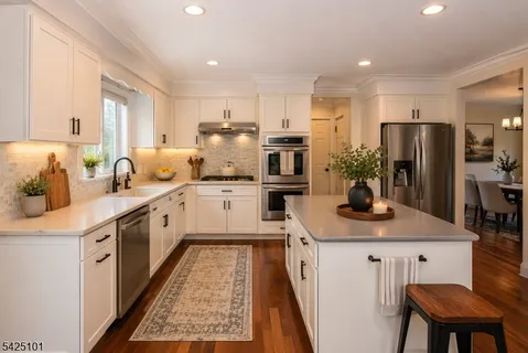 a kitchen with a sink stove and refrigerator