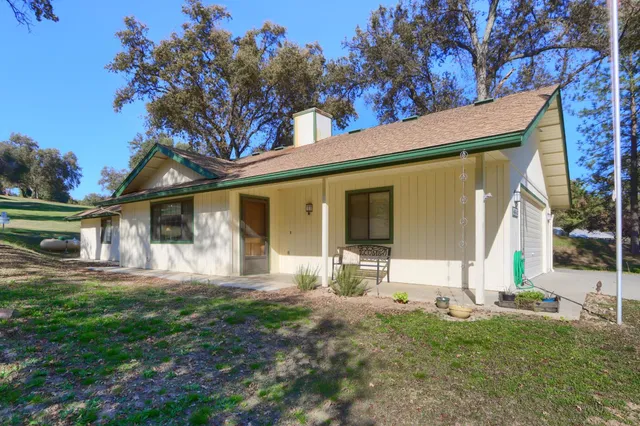 a front view of a house with a yard and porch