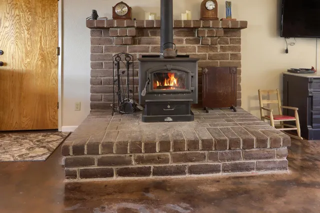 a bedroom with a bed and a television