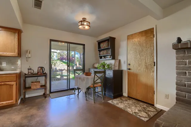 a view of a livingroom with furniture window and wooden floor