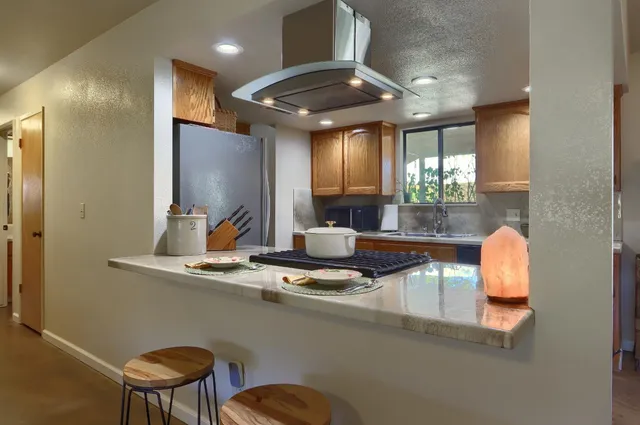 a kitchen with a sink cabinets and window