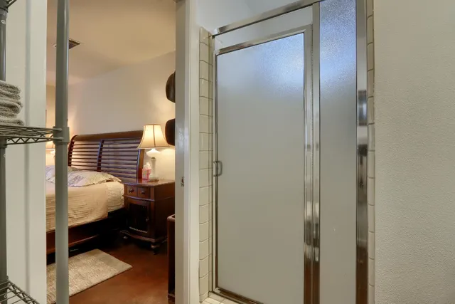 a bedroom with a bed and a cabinets