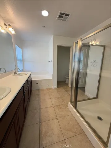 a bathroom with a sink a mirror and a shower