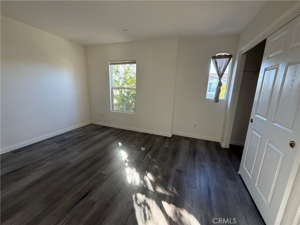 4520 Filson Street Riverside, CA 92507 - Photo 23 of 29 a view of an empty room with wooden floor and a window