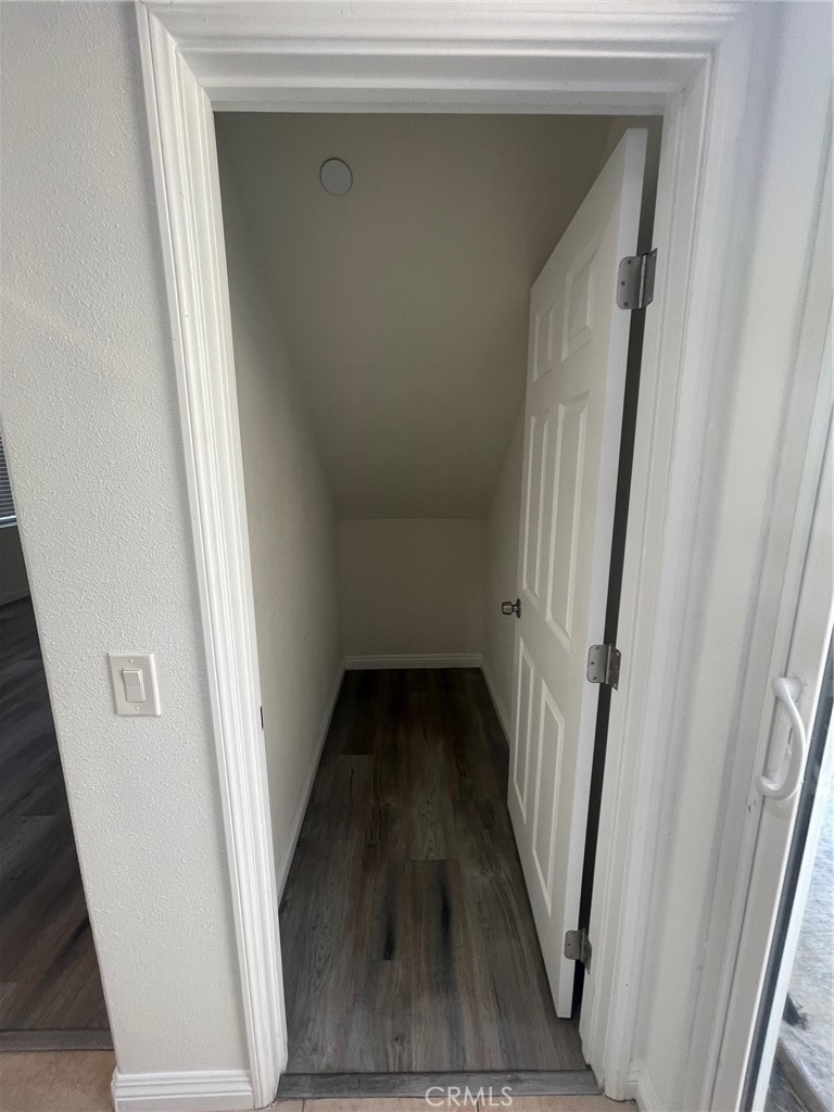 4520 Filson Street Riverside, CA 92507 - Photo 28 of 29 a view of a hallway with wooden floor and staircase