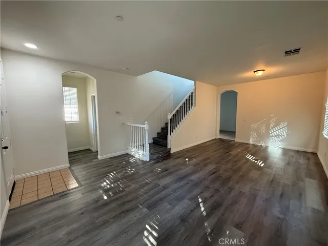 a view of a livingroom with wooden floor