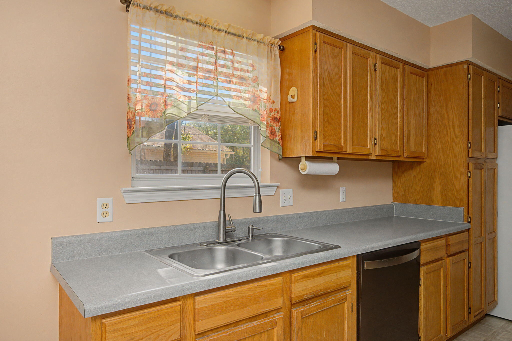 223 Runnymeade Drive Crestview, FL 32539 - Photo 13 of 38 a kitchen with granite countertop a sink and a window
