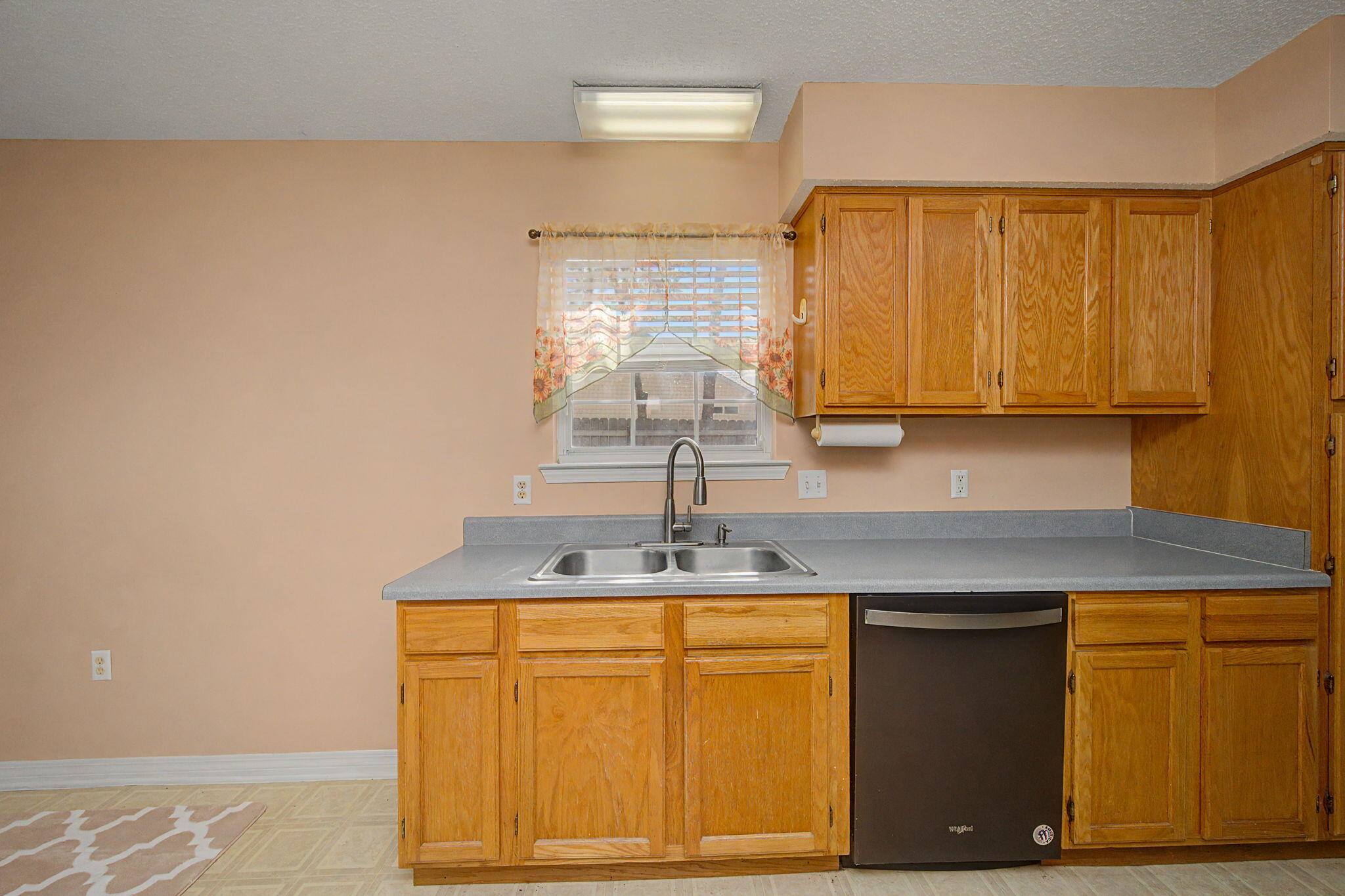 223 Runnymeade Drive Crestview, FL 32539 - Photo 17 of 38 a kitchen with a sink and cabinets