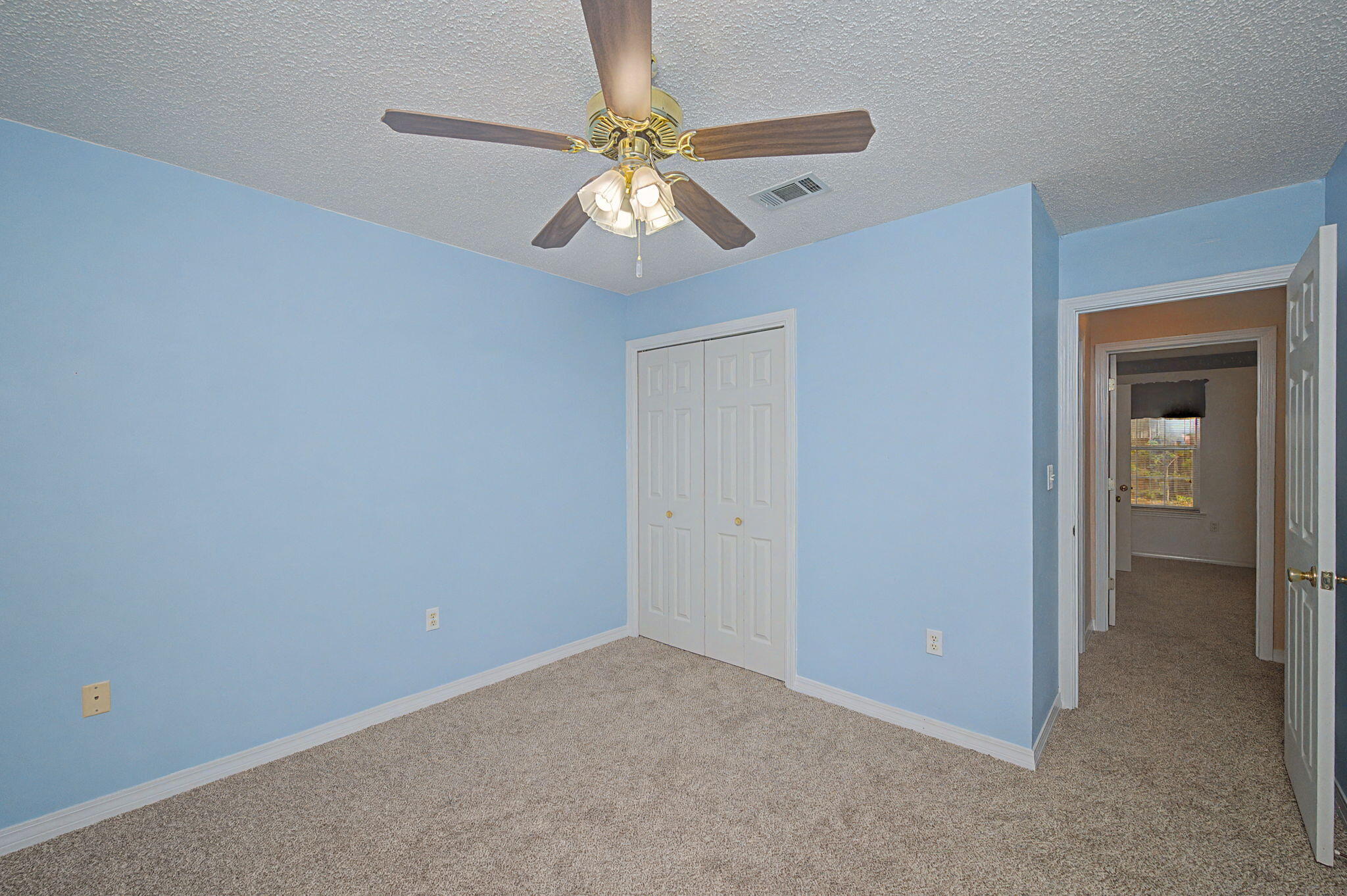 223 Runnymeade Drive Crestview, FL 32539 - Photo 19 of 38 a view of an empty room with a fan