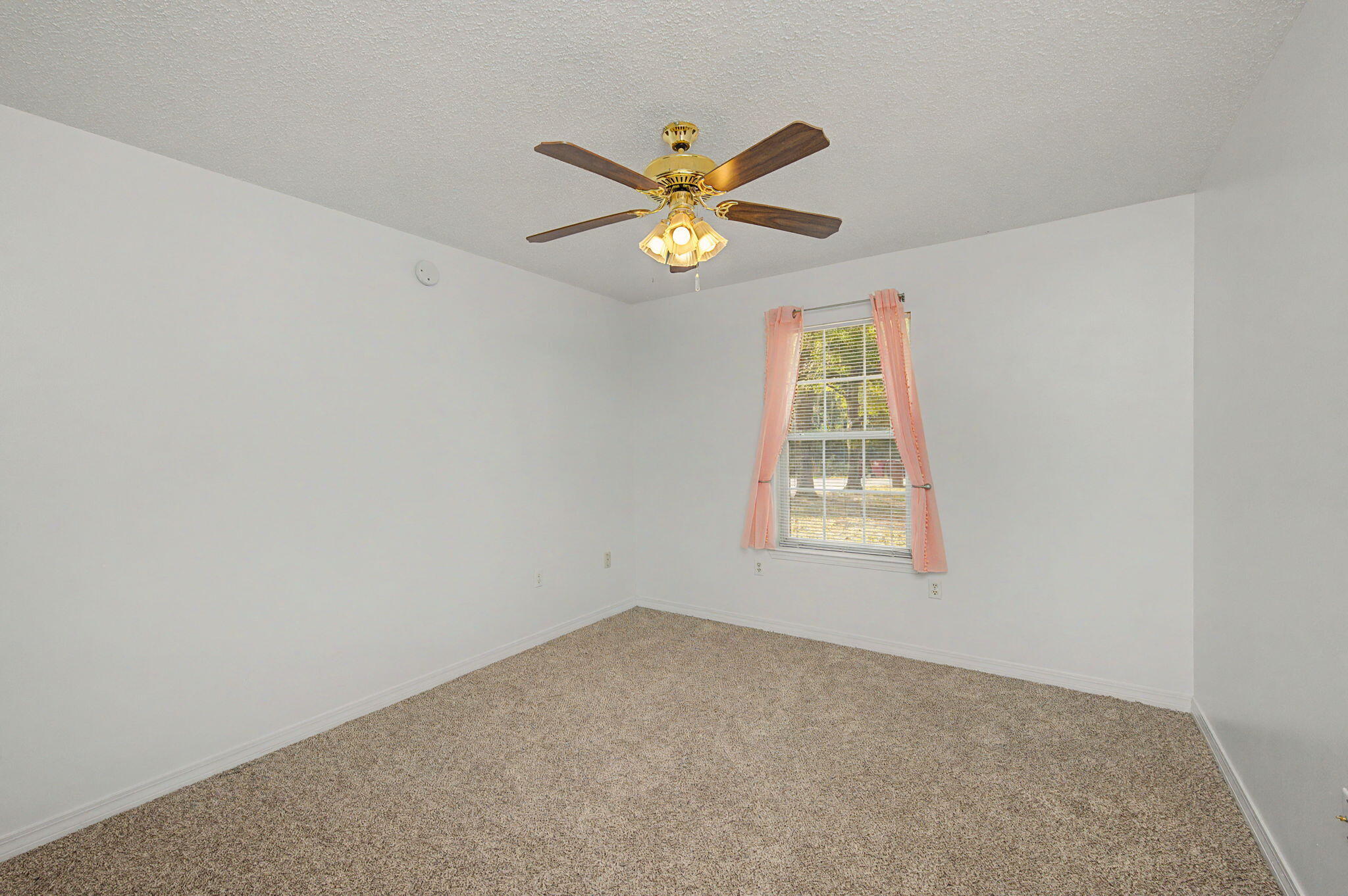 223 Runnymeade Drive Crestview, FL 32539 - Photo 20 of 38 a view of an empty room with a window