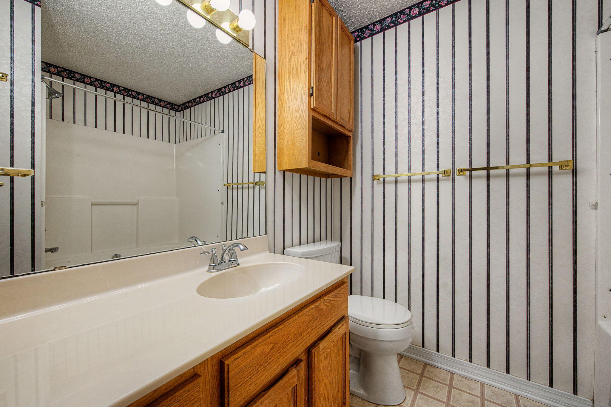 223 Runnymeade Drive Crestview, FL 32539 - Photo 27 of 38 a bathroom with a sink toilet and shower