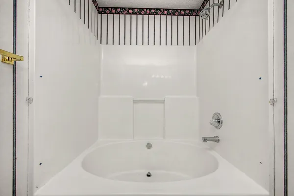a bathroom with a white tub