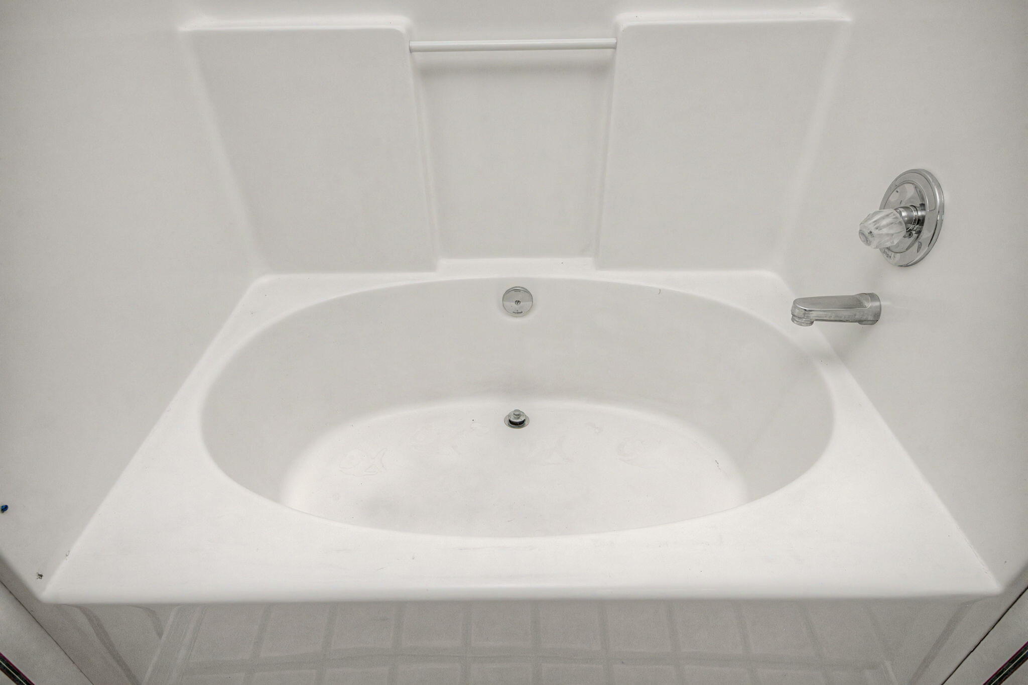 223 Runnymeade Drive Crestview, FL 32539 - Photo 29 of 38 a white bath tub sitting in a bathroom