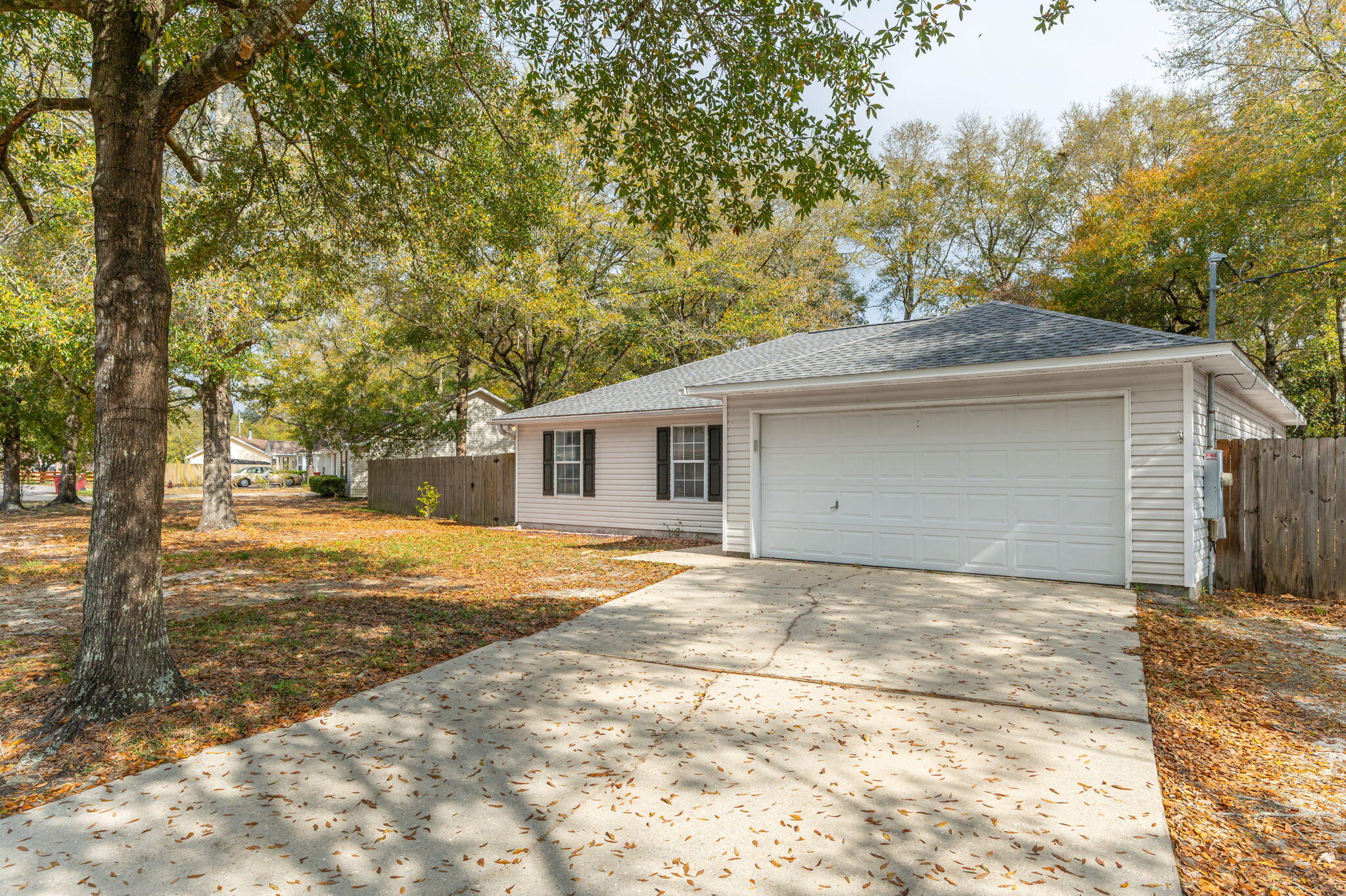 223 Runnymeade Drive Crestview, FL 32539 - Photo 3 of 38 a view of a house with a yard and garage