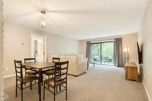 a view of a livingroom with furniture and window