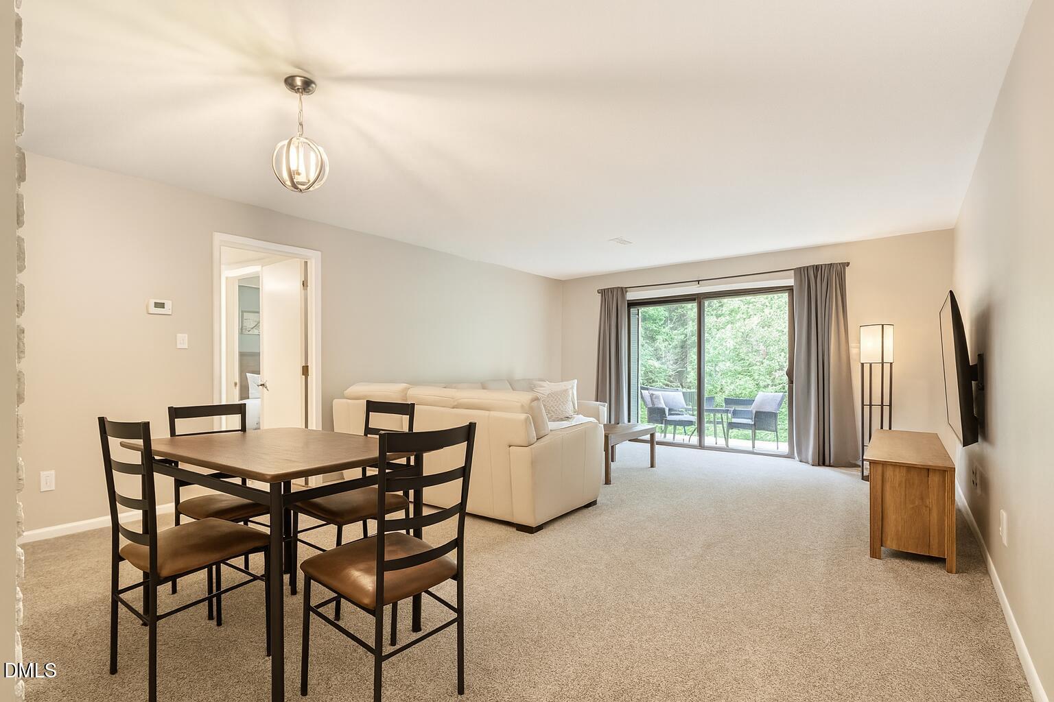 677 Pine Ridge Place, Unit 677 Raleigh, NC 27609 - Photo 2 of 9 a view of a livingroom with furniture and window