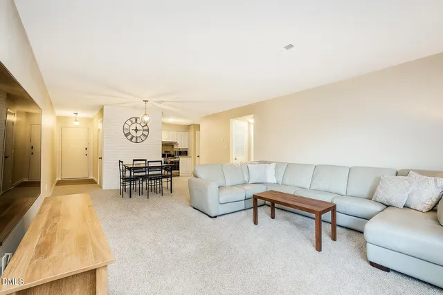 a living room with furniture and a couch
