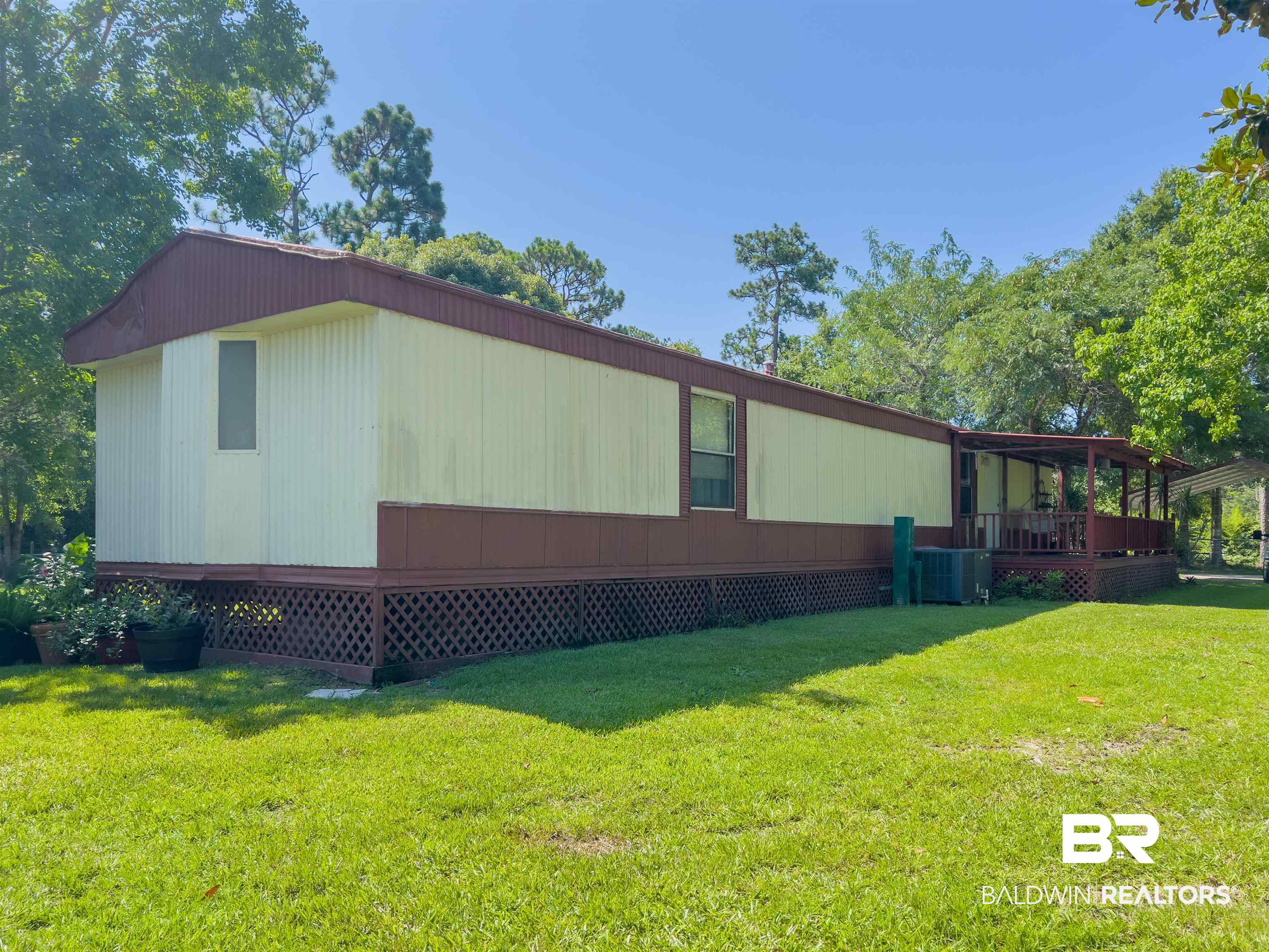 9190 County Road 97 Elberta, AL 36530 - Photo 9 of 53 View of home's exterior featuring a yard and central AC