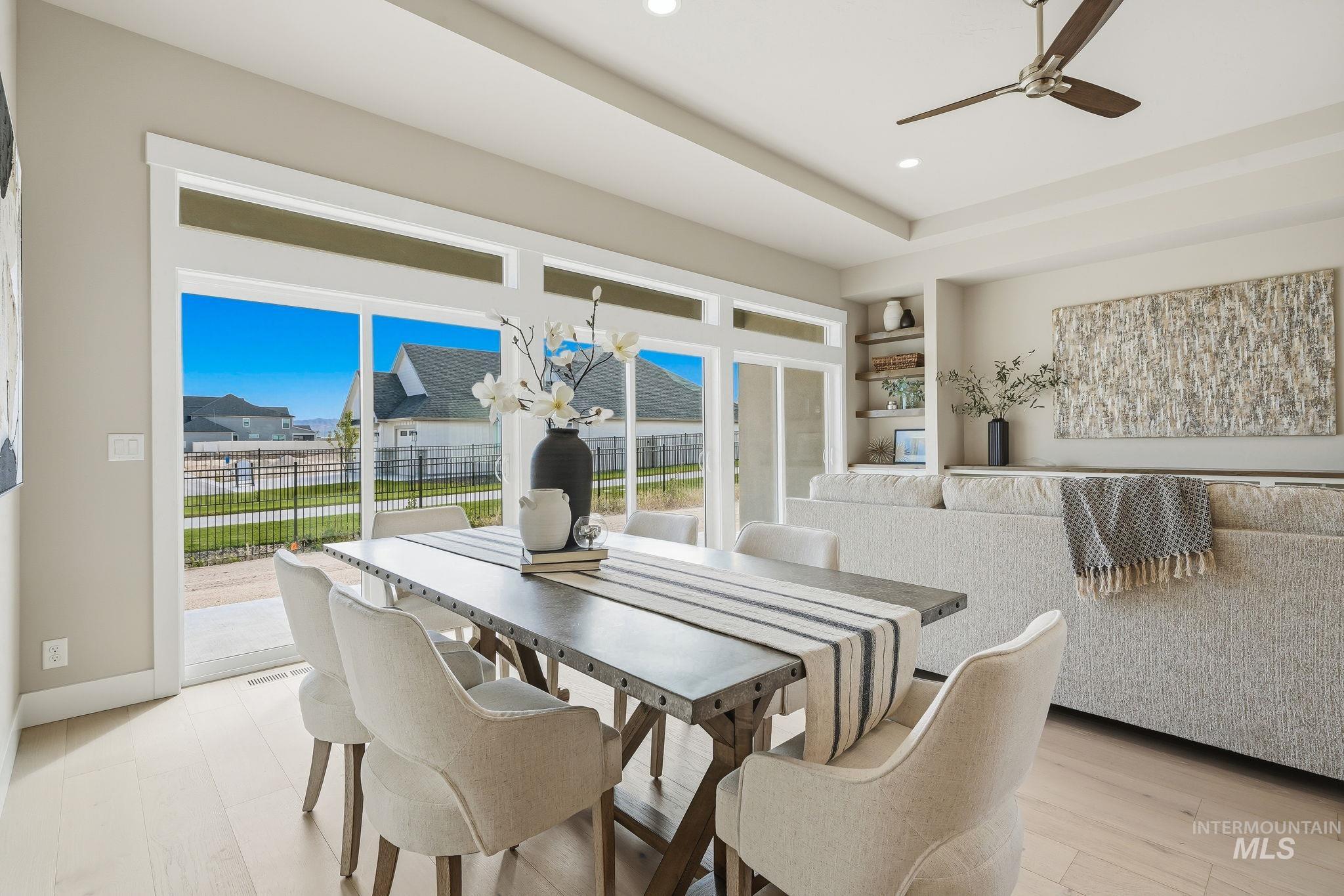 470 South Radiator Way Boise, ID 83716 - Photo 16 of 50 Dining area featuring light wood-finish flooring and a tray ceiling with recessed lighting