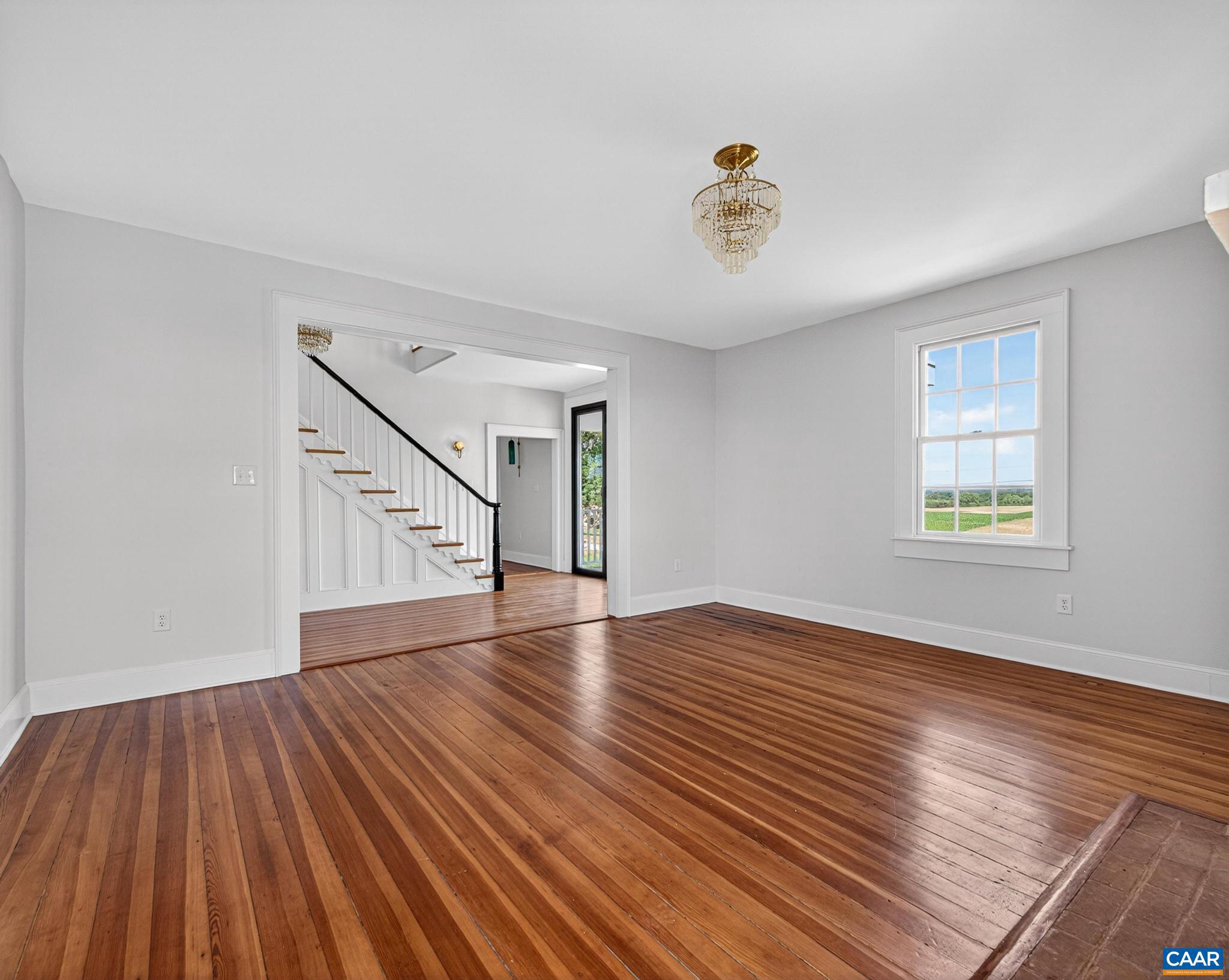 481 Race Ground Road Somerset, VA 22972 - Photo 9 of 53 wooden floor in an empty room with a window