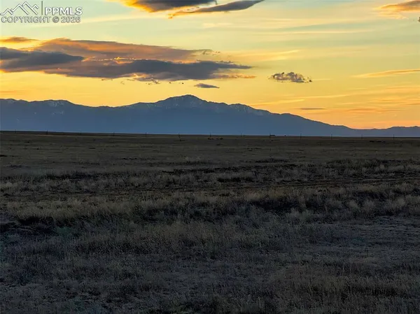 a view of an ocean and a mountain
