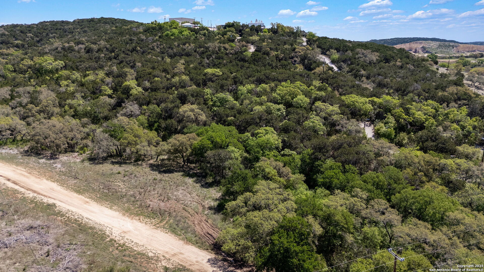 0 North State Highway 16 Helotes, TX 78023 - Photo 2 of 17 a view of a city with lush green forest