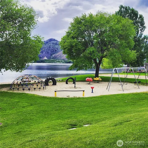 a view of a patio with table and chairs potted plants