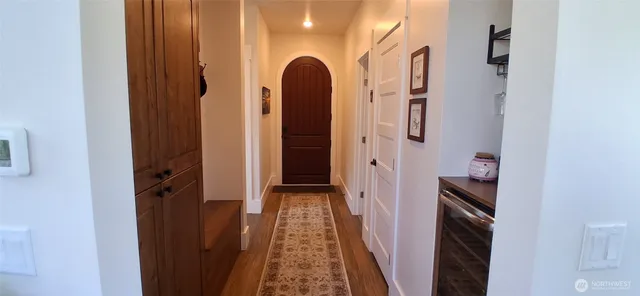 a view of living room and mirror