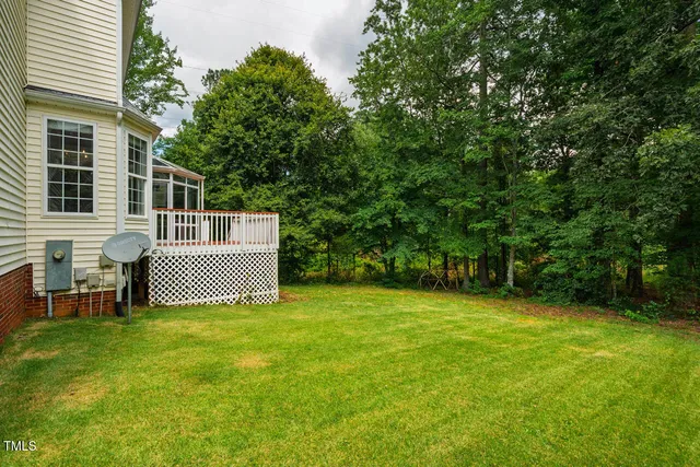 a view of a yard with a tree