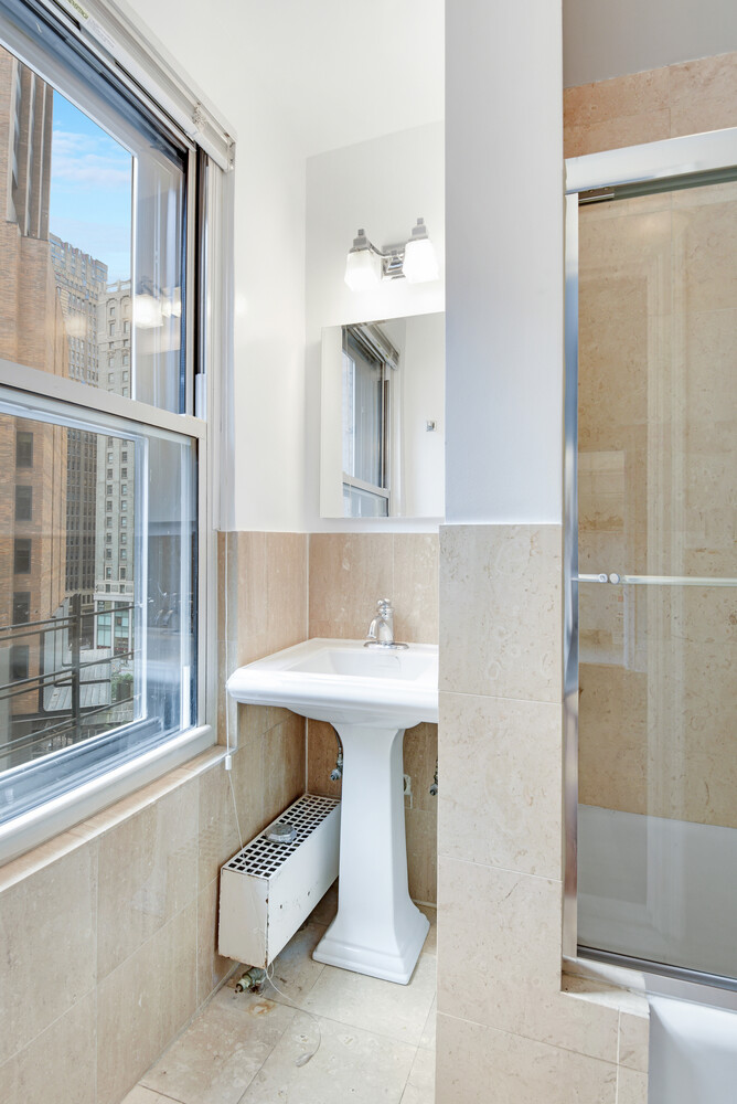 7 Park Avenue, Unit 8A9ABC Manhattan, NY 10016 - Photo 14 of 21 a bathroom with a sink and a mirror