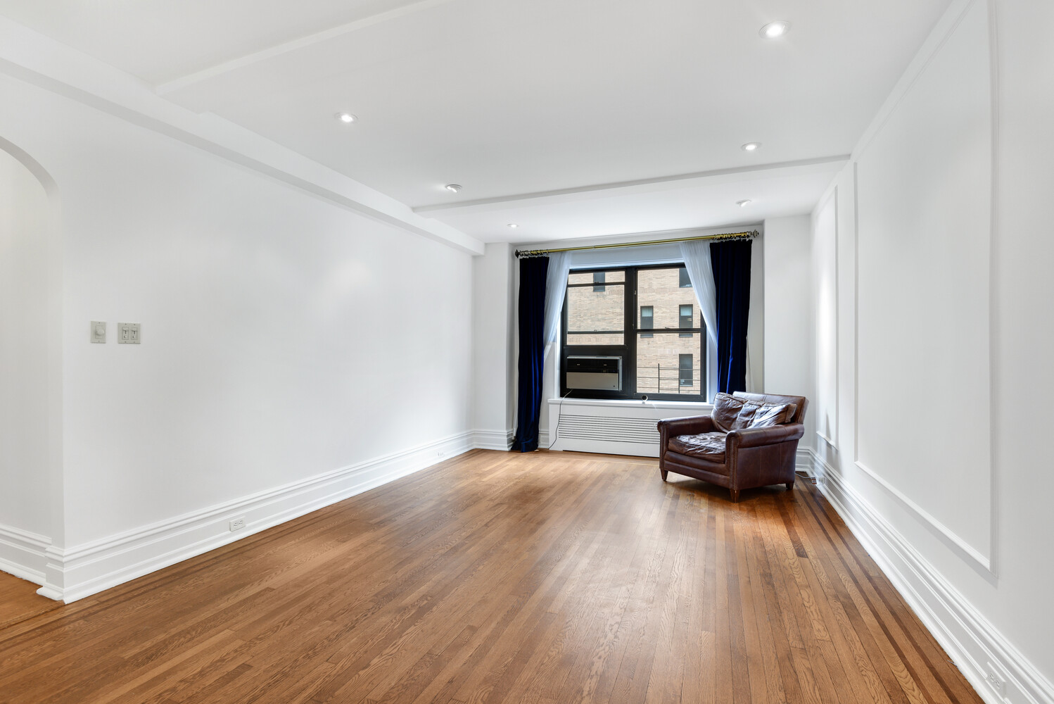 7 Park Avenue, Unit 8A9ABC Manhattan, NY 10016 - Photo 8 of 21 a living room with furniture and wooden floor
