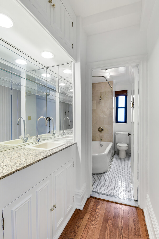 7 Park Avenue, Unit 8A9ABC Manhattan, NY 10016 - Photo 9 of 21 a en suite bathroom with a granite countertop tub sink and mirror