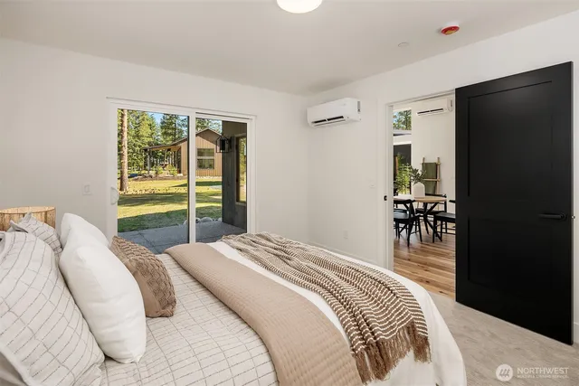 a bedroom with a bed and a dresser