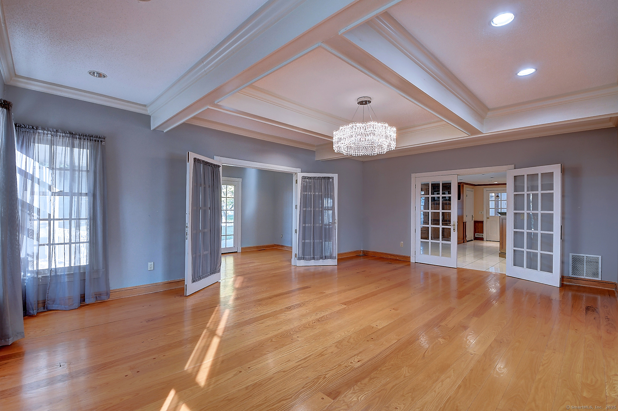 615 Ridge Road Wethersfield, CT 06109 - Photo 10 of 40 a view of an empty room with wooden floor and windows