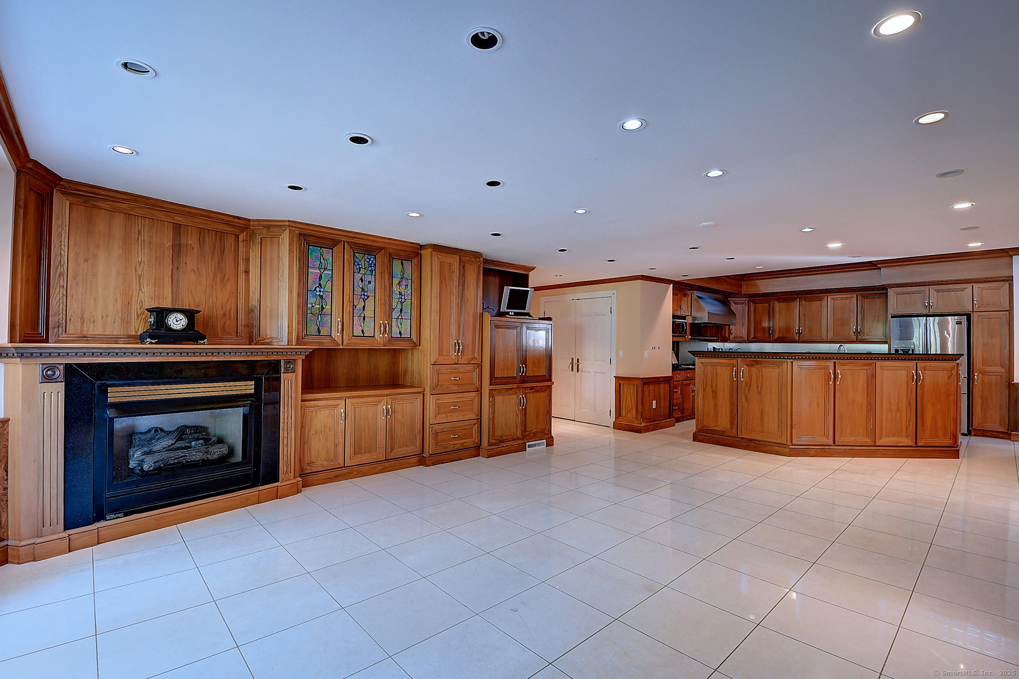 615 Ridge Road Wethersfield, CT 06109 - Photo 15 of 40 a view of an empty room with a fireplace and cabinet