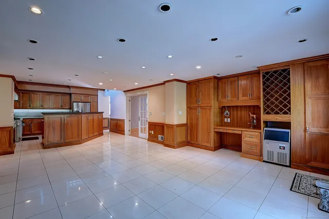 a view of a kitchen with a fridge and a sink