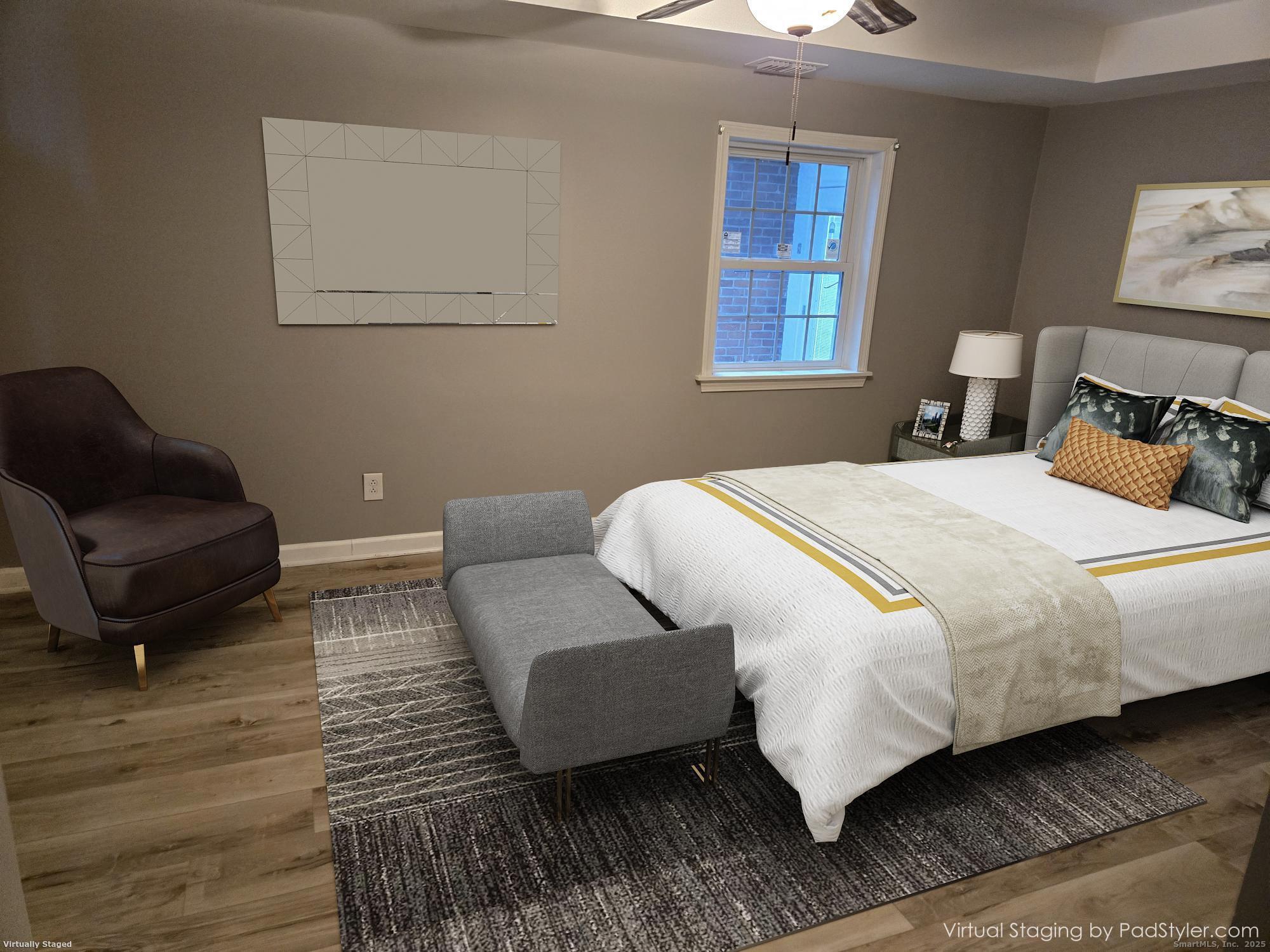 615 Ridge Road Wethersfield, CT 06109 - Photo 18 of 40 a bedroom with a bed and wooden floor